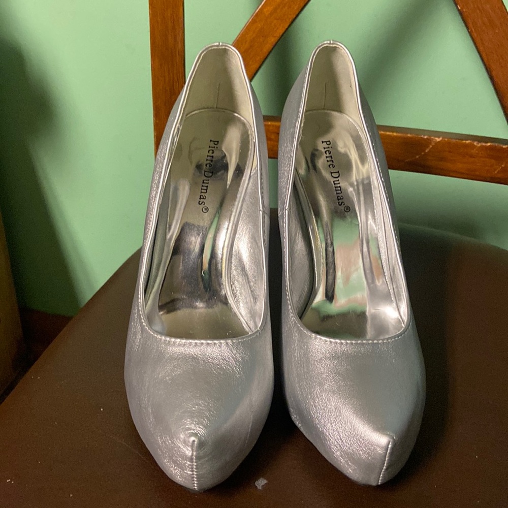 Brand new in the box still smells new. Pierre Dumas Silver heels size 8.5.